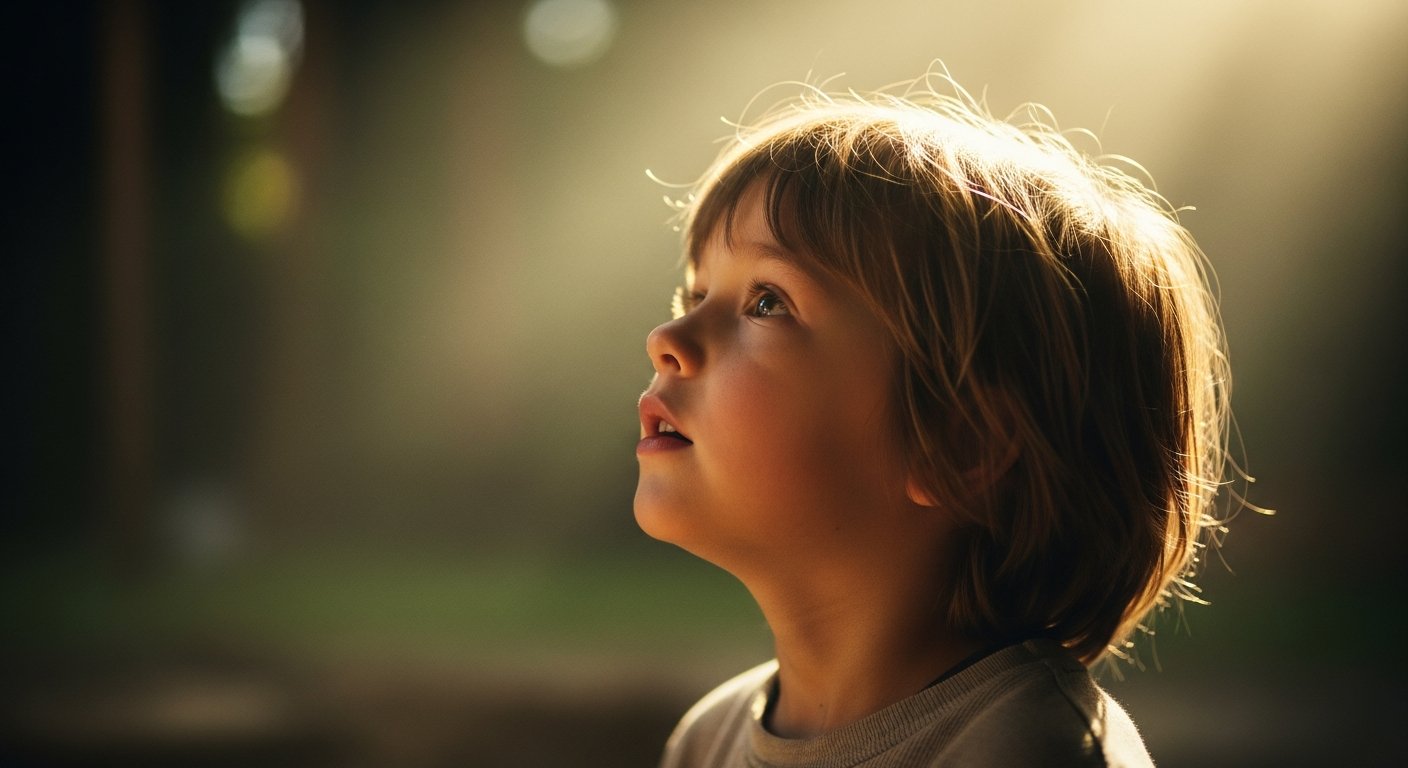 Child looking upward with hope